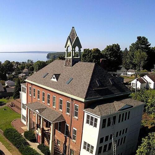 a church with a shingle roof