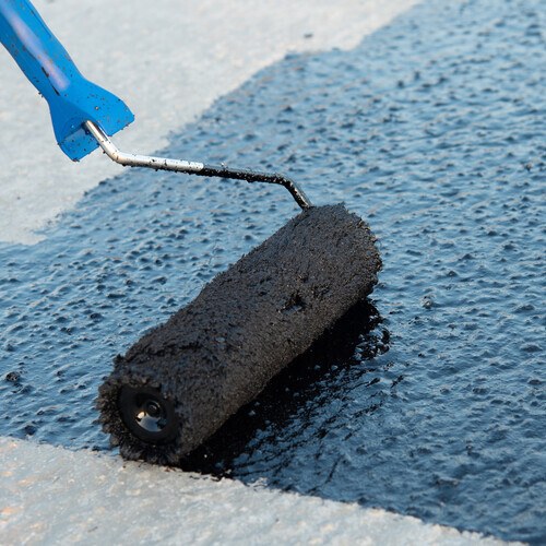 Roller brush waterproofing.  a flat roof coating.
