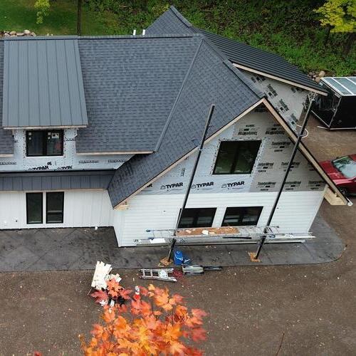 workers installing a new roof