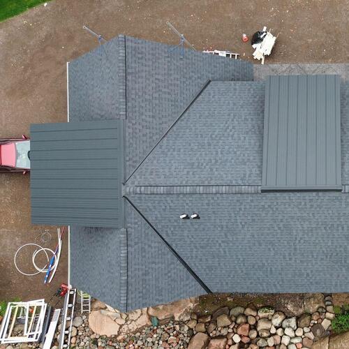 view from above of repairs on a shingle roof