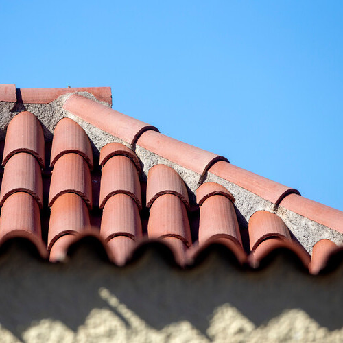 a closeup of a home with a tile roof